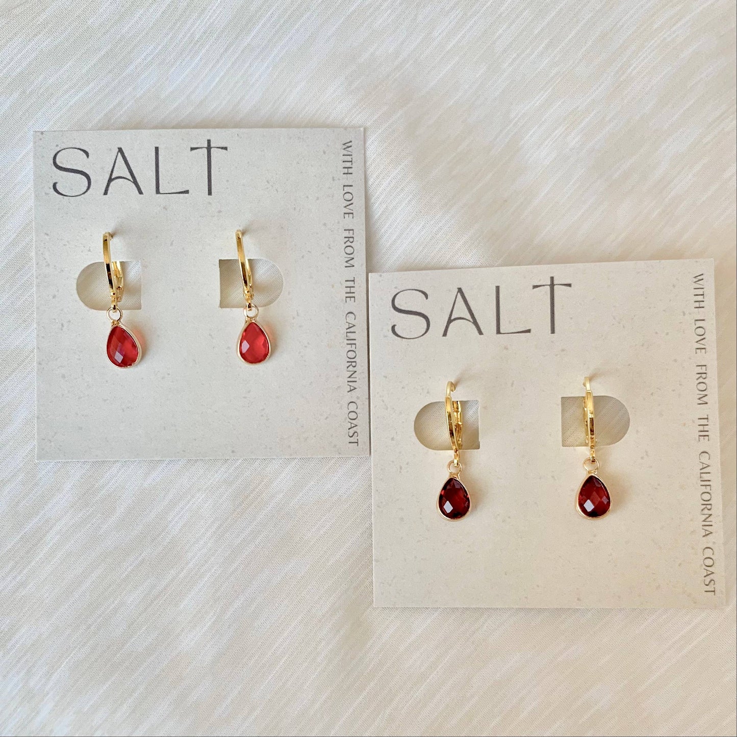 RUBY RED HUGGIE HOOPS | gold