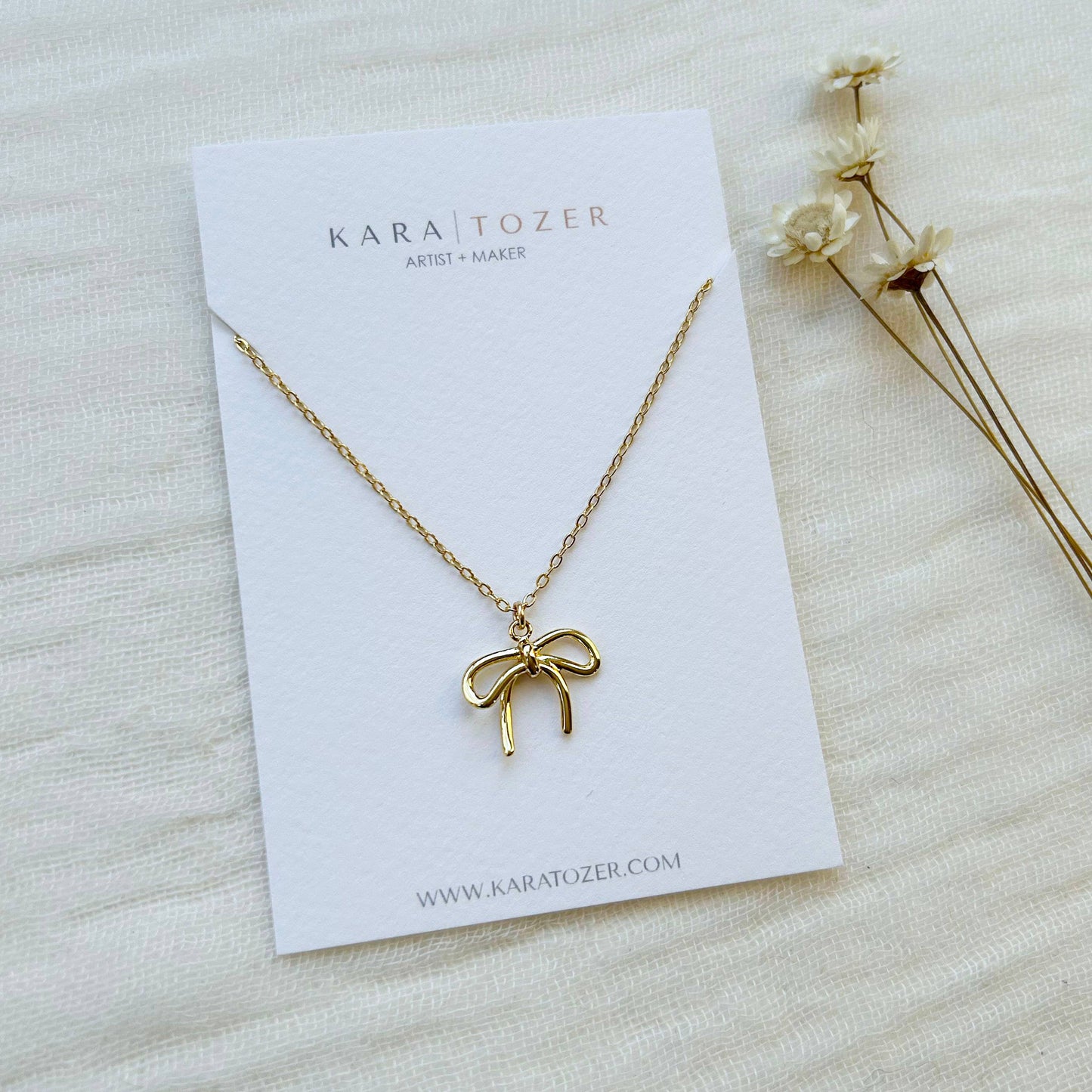 Gold Bow Charm Necklace