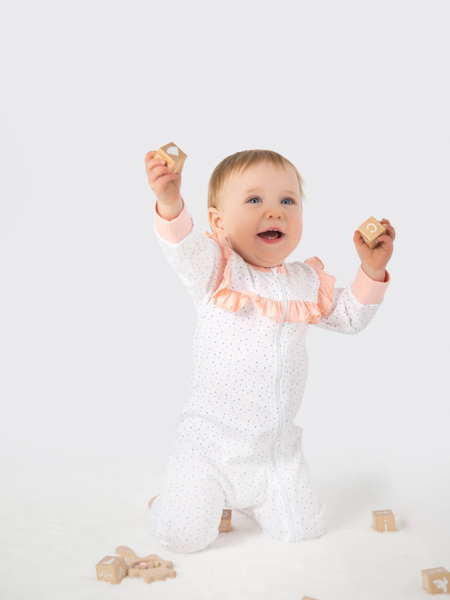 Evy Ruffled Romper / Pink Polka dots